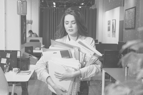 Busy tina the bookkeeper holding too many client's files.